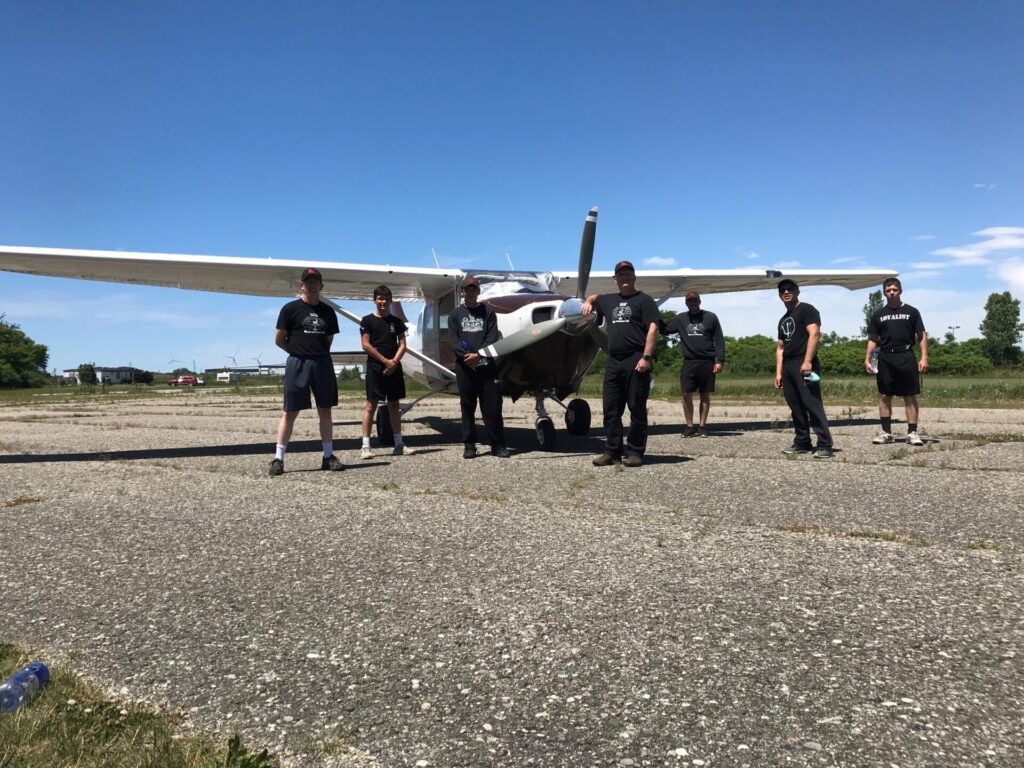Group picture with a plane