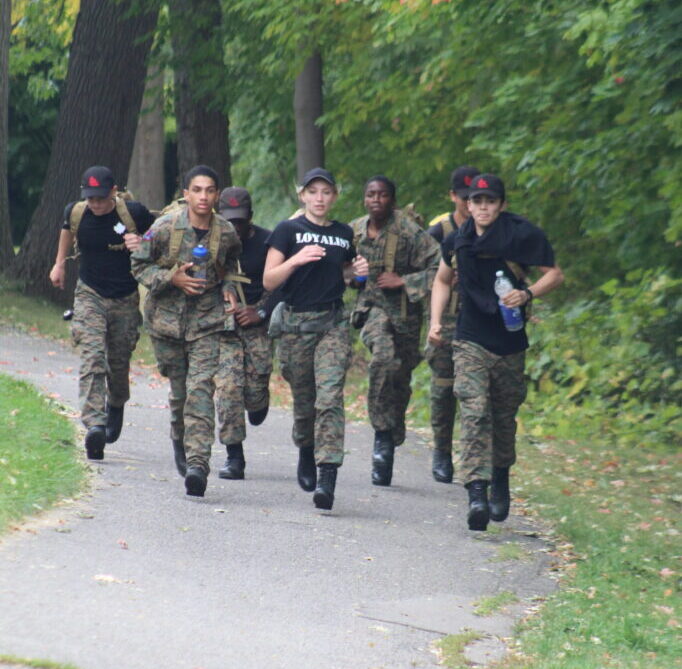 Students running on a trail